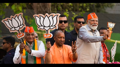 Prime Minister Narendra Modi, Uttar Pradesh Chief Minister Yogi Adityanath, Union Minister of State VK Singh and BJP candidate Atul Garg during a roadshow ahead of the upcoming Lok Sabha election, in Ghaziabad, Saturday (PTI) Prime Minister Narendra Modi, Uttar Pradesh Chief Minister Yogi Adityanath, Union Minister of State VK Singh and BJP candidate Atul Garg during a roadshow ahead of the upcoming Lok Sabha election, in Ghaziabad, Saturday (PTI)