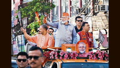 Prime Minister Narendra Modi and Uttar Pradesh CM Yogi Adityanath at a road show in Ghaziabad on Saturday. (Ajay Aggarwal/HT Photo) Prime Minister Narendra Modi and Uttar Pradesh CM Yogi Adityanath at a road show in Ghaziabad on Saturday. (Ajay Aggarwal/HT Photo)