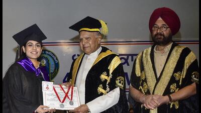 Punjab governor Banwarilal Purohit awarding degree to a student in presence of V-C Jaspal Singh Sandhu (R) during 49th annual convocation of Guru Nanak Dev University in Amritsar on Saturday. (Sameer Sehgal/HT) Punjab governor Banwarilal Purohit awarding degree to a student in presence of V-C Jaspal Singh Sandhu (R) during 49th annual convocation of Guru Nanak Dev University in Amritsar on Saturday. (Sameer Sehgal/HT)