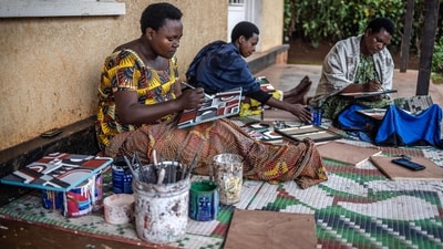 A 200-year-old Tutsi art form made with cow dung, Rwanda's Imigongo painting tradition has experienced a revival in the Great Lakes nation three decades after the 1994 genocide, becoming a symbol of culture and unity. (Photo by LUIS TATO / AFP) A 200-year-old Tutsi art form made with cow dung, Rwanda's Imigongo painting tradition has experienced a revival in the Great Lakes nation three decades after the 1994 genocide, becoming a symbol of culture and unity. (Photo by LUIS TATO / AFP)