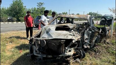 The sports utility vehicle of assistant commissioner of police Sandeep Singh, which caught fire, after colliding with another SUV at Dyalpura bypass near Samrala town of Ludhiana district on Saturday. (Gurpreet Singh/HT) The sports utility vehicle of assistant commissioner of police Sandeep Singh, which caught fire, after colliding with another SUV at Dyalpura bypass near Samrala town of Ludhiana district on Saturday. (Gurpreet Singh/HT)