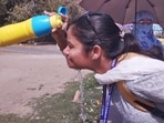 A girl splashing cool water on her face during a hot summer day in Patna, Bihar. (Hindustan Times)
