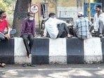 An image of daily wage workers sitting near Dandekar bridge in Pune during the pandemic awaiting work