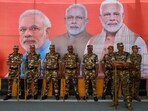 Military personnel stand watch as people wait for India's Prime Minister Narendra Modi's arrival for a roadshow, ahead of the general elections, in Ghaziabad, India, April 6, 2024.(REUTERS)