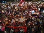 People take part in a protest against Israeli Prime Minister Benjamin Netanyahu's government and call for the release of hostages held in the Gaza Strip by the Hamas militant group. People take part in a protest against Israeli Prime Minister Benjamin Netanyahu's government and call for the release of hostages held in the Gaza Strip by the Hamas militant group.
