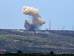A picture taken from the southern Lebanese village of Alma al-Shaab shows smoke rising from an Israeli outpost A picture taken from the southern Lebanese village of Alma al-Shaab shows smoke rising from an Israeli outpost