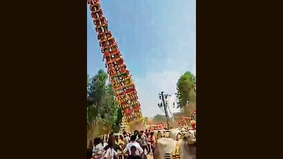A 120-foot tall temple chariot collapses during a religious and cultural event near Anekal in Karnataka on Saturday. (PTI) A 120-foot tall temple chariot collapses during a religious and cultural event near Anekal in Karnataka on Saturday. (PTI)