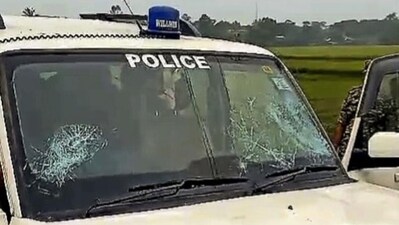 A police vehicle after it was attacked by villagers in Purba Medinipur. (PTI) A police vehicle after it was attacked by villagers in Purba Medinipur. (PTI)