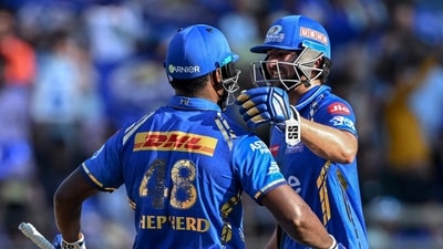 Mumbai Indians' Romario Shepherd and Tim David (R) greet each other during the Indian Premier League match against Delhi Capitals at the Wankhede Stadium in Mumbai. (AFP) Mumbai Indians' Romario Shepherd and Tim David (R) greet each other during the Indian Premier League match against Delhi Capitals at the Wankhede Stadium in Mumbai. (AFP)