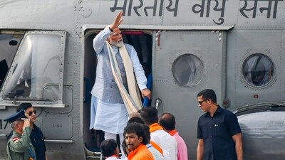 Prime Minister Narendra Modi arrives for a public meeting ahead of the Lok Sabha elections, at Dhupguri in Jalpaiguri district, Sunday (PTI)