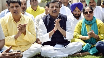 Aam Aadmi Party (AAP) MP Sanjay Singh with his wife Anita Singh, Delhi Minister Saurabh Bhardwaj and party supporters during his visit to Raj Ghat. (ANI)