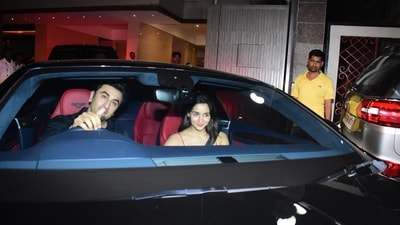 Ranbir Kapoor and Alia Bhatt were all smiles as the paparazzi clicked photographs. They also waved to the paparazzi as they sat inside their black Bentley. Ranbir even joked with paparazzi to come sit inside the car. (Pic: Varinder Chawla) Ranbir Kapoor and Alia Bhatt were all smiles as the paparazzi clicked photographs. They also waved to the paparazzi as they sat inside their black Bentley. Ranbir even joked with paparazzi to come sit inside the car. (Pic: Varinder Chawla)