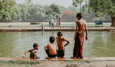 Kids try to beat the summer heat by taking a much needed dip in a pond (Unsplash) Kids try to beat the summer heat by taking a much needed dip in a pond (Unsplash)