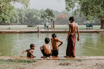 Kids try to beat the summer heat by taking a much needed dip in a pond (Unsplash) Kids try to beat the summer heat by taking a much needed dip in a pond (Unsplash)