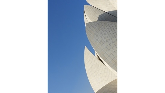 The Lotus Temple viewed from the leisurely horizontal comforts of the nearly infinite and immaculate green lawns surrounding the temple and its many water gardens, providing an architectural match to the sprawling flora and fauna with its own concrete flower petals as its crown.(Nikola Olić )
