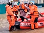 In this grab taken from a video released by the Russian Emergency Ministry Press Service on Saturday, April 6, 2024, emergency workers evacuate a local resident after a part of a dam burst causing flooding, in Orsk, Russia. Floods hit a city in the Ural Mountains areas after a river dam burst there, prompting evacuations of hundreds of people, local authorities said. In this grab taken from a video released by the Russian Emergency Ministry Press Service on Saturday, April 6, 2024, emergency workers evacuate a local resident after a part of a dam burst causing flooding, in Orsk, Russia. Floods hit a city in the Ural Mountains areas after a river dam burst there, prompting evacuations of hundreds of people, local authorities said.