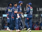 Lucknow Super Giants' Yash Thakur (2L) celebrates with teammates after taking a wicket. Lucknow Super Giants' Yash Thakur (2L) celebrates with teammates after taking a wicket.