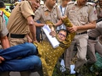 Delhi Police personnel detain TMC leader Saket Gokhale during a dharna of a TMC delegation after a meeting with Election Commission of India (ECI), outside ECI's office. (PTI) Delhi Police personnel detain TMC leader Saket Gokhale during a dharna of a TMC delegation after a meeting with Election Commission of India (ECI), outside ECI's office. (PTI)