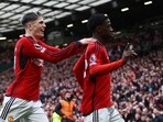 Manchester United's Kobbie Mainoo celebrates scoring their second goal with Alejandro Garnacho.
