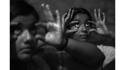 Arya and Akshaya, students of the first batch of female students of Kathakali at Kerala Kalamandalam seen practicing Kannusadhakam (eye exercises) during their 5am Sadhakam in Thrissur district, in Kerala on June 29, 2023. With their entry, it’s curtains for a 90-year-old, men-only tradition at the Kalamandalam. (Winning image for Danish Siddiqui Award for Socially Concerned Photography - Photo of the Year). (Thulasi Kakkat) Arya and Akshaya, students of the first batch of female students of Kathakali at Kerala Kalamandalam seen practicing Kannusadhakam (eye exercises) during their 5am Sadhakam in Thrissur district, in Kerala on June 29, 2023. With their entry, it’s curtains for a 90-year-old, men-only tradition at the Kalamandalam. (Winning image for Danish Siddiqui Award for Socially Concerned Photography - Photo of the Year). (Thulasi Kakkat)