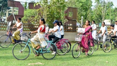 People participate in the Voters Awareness Cycle Rally organized as an initiative of the Systematic Voters' Education and Electoral Participation (SVEEP) cell in Bokakhat, Assam. (ANI)