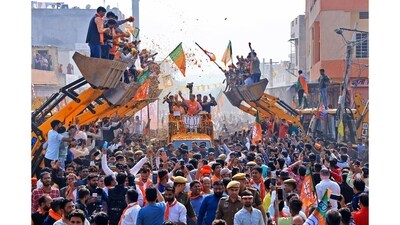Uttar Pradesh Chief Minister Yogi Adityanath seen participating in a roadshow aboard a bulldozer in support of BJP candidate Rajyavardhan Singh Rathore from the Jhotwara constituency ahead of the Rajasthan Assembly elections in Jaipur, Rajasthan, India, on November 23, 2023. According to the author of the image, Yogi Adityanath may be credited as the inventor of the bulldozer as a weapon for politics.(Winning image in the News and Current Affairs Single category- single image). (Vishal Bhatnagar) Uttar Pradesh Chief Minister Yogi Adityanath seen participating in a roadshow aboard a bulldozer in support of BJP candidate Rajyavardhan Singh Rathore from the Jhotwara constituency ahead of the Rajasthan Assembly elections in Jaipur, Rajasthan, India, on November 23, 2023. According to the author of the image, Yogi Adityanath may be credited as the inventor of the bulldozer as a weapon for politics.(Winning image in the News and Current Affairs Single category- single image). (Vishal Bhatnagar)