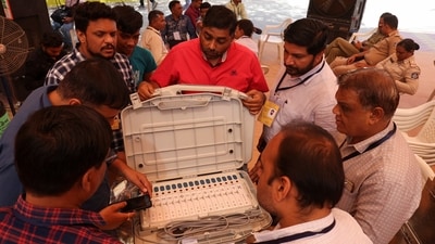 Election staff scans serial numbers of Electronic Voting Machines (EVMs) before dispatching them from a warehouse in Ahmedabad. (Amit Dave / Reuters)