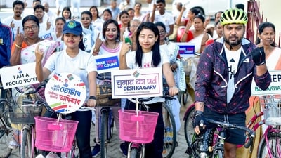 State Election icon and paracyclist Rakesh Banik along with others participates in the voters' awareness cycle rally organized as an initiative of the Systematic Voters' Education and Electoral Participation (SVEEP) cell in Bokakhat, Assam. (ANI)