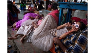 A family resting at Oachira Parabrahma temple during the festival season. (Winning image in the Daily Life and Culture category – single image). (Joseph Rahul) A family resting at Oachira Parabrahma temple during the festival season. (Winning image in the Daily Life and Culture category – single image). (Joseph Rahul)