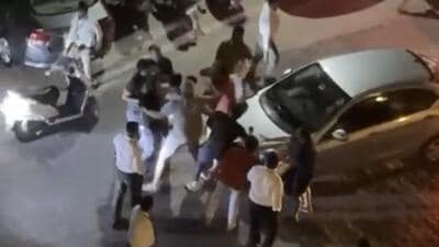 A video was purportedly made by a resident from balcony of his flat in a tower nearby, showing security guards and some residents trying to break up the fight. (HT Photo) A video was purportedly made by a resident from balcony of his flat in a tower nearby, showing security guards and some residents trying to break up the fight. (HT Photo)