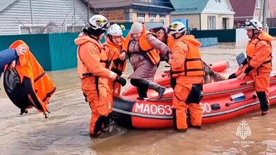 In this grab taken from a video released by the Russian Emergency Ministry Press Service on Saturday, April 6, 2024, emergency workers evacuate a local resident after a part of a dam burst causing flooding, in Orsk, Russia. Floods hit a city in the Ural Mountains areas after a river dam burst there, prompting evacuations of hundreds of people, local authorities said. (AP) In this grab taken from a video released by the Russian Emergency Ministry Press Service on Saturday, April 6, 2024, emergency workers evacuate a local resident after a part of a dam burst causing flooding, in Orsk, Russia. Floods hit a city in the Ural Mountains areas after a river dam burst there, prompting evacuations of hundreds of people, local authorities said. (AP)