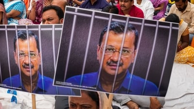 Aam Aadmi Party (AAP) supporters hold placards with a photograph of Delhi chief minister Arvind Kejriwal during a hunger strike organised by the AAP at Jantar Mantar in New Delhi on April 7. (Bloomberg) Aam Aadmi Party (AAP) supporters hold placards with a photograph of Delhi chief minister Arvind Kejriwal during a hunger strike organised by the AAP at Jantar Mantar in New Delhi on April 7. (Bloomberg)
