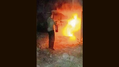 Ludhiana civil hospital employees trying to douse the flames at the oxygen plant. (HT Photo)