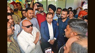 MLA Gurpreet Gogi and parents interacting with BCM school authorities in Ludhiana on Monday. (Gurpreet Singh/HT)