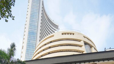 Mumbai: People move past a digital screen at the facade of the BSE during the presentation of the Interim Budget 2024 in Parliament by Union Finance Minister Nirmala Sitharaman, in Mumbai, Thursday, Feb. 1, 2024. (PTI Photo/Shashank Parade) (PTI02_01_2024_000217A) (PTI) Mumbai: People move past a digital screen at the facade of the BSE during the presentation of the Interim Budget 2024 in Parliament by Union Finance Minister Nirmala Sitharaman, in Mumbai, Thursday, Feb. 1, 2024. (PTI Photo/Shashank Parade) (PTI02_01_2024_000217A) (PTI)