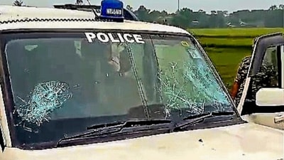 A police vehicle after it was allegedly attacked by villagers during NIA's investigation into the 2022 Bhupatinagar blast case in Purba Medinipur district, on April 6. (PTI)