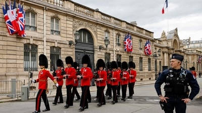 British members of Number 7 Company Coldstream Guards march along the street outside the Elysee Palace, as they make their way into the courtyard, in Paris (AFP) British members of Number 7 Company Coldstream Guards march along the street outside the Elysee Palace, as they make their way into the courtyard, in Paris (AFP)