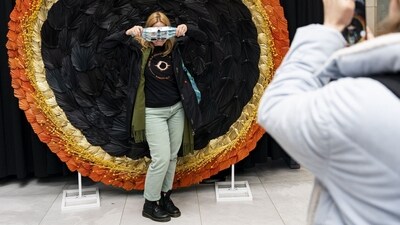 A visitor poses for a photograph in front of a solar eclipse themed display in Niagara Falls, Ontario, Canada. A total solar eclipse will occur across North America on Monday. (Bloomberg) A visitor poses for a photograph in front of a solar eclipse themed display in Niagara Falls, Ontario, Canada. A total solar eclipse will occur across North America on Monday. (Bloomberg)