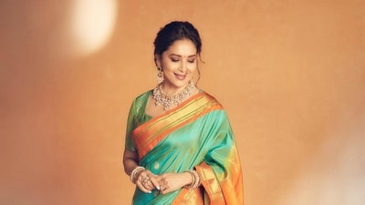 First and foremost, women are adorned in paithani sarees available in bright colours with intricate hand embroidery. This traditional classic piece is a wardrobe essential for your Gudi Padwa celebrations and can be paired with naths, bangles, and jhumkas for an elegant look. (Instagram) First and foremost, women are adorned in paithani sarees available in bright colours with intricate hand embroidery. This traditional classic piece is a wardrobe essential for your Gudi Padwa celebrations and can be paired with naths, bangles, and jhumkas for an elegant look. (Instagram)