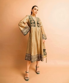 Karisma Kapoor dons a golden ethnic dress adorned with intricate zardozi, thread and sequin embroidery (Photo: Instagram)