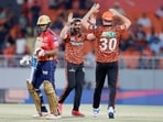Sunrisers Hyderabad's captain Pat Cummins and teammate Nitish Reddy celebrate the dismissal of Punjab Kings' Jitesh Sharma during their match in the Indian Premier League 2024.

