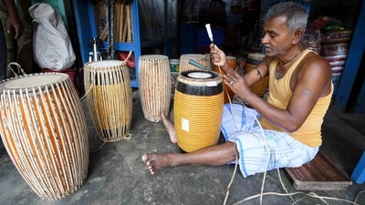 An artisan makes traditional dhol (drum) ahead of the Rongali Bihu festival in Nagaon, Assam. (ANI) An artisan makes traditional dhol (drum) ahead of the Rongali Bihu festival in Nagaon, Assam. (ANI)