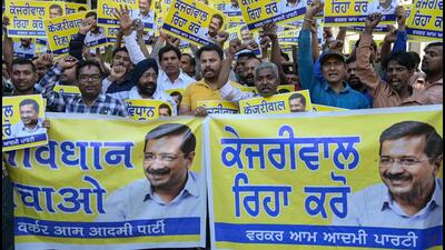 Aam Aadmi Party (AAP) supporters at a protest demanding Kejriwal’s release. (AFP) Aam Aadmi Party (AAP) supporters at a protest demanding Kejriwal’s release. (AFP)