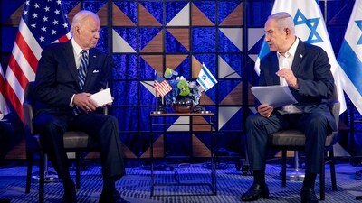 FILE PHOTO: U.S. President Joe Biden, left, meets with Israeli Prime Minister Benjamin Netanyahu, right, to discuss the ongoing conflict between Israel and Hamas, in Tel Aviv, Israel, Wednesday, Oct. 18, 2023. Miriam Alster/Pool via REUTERS/File Photo (via REUTERS)