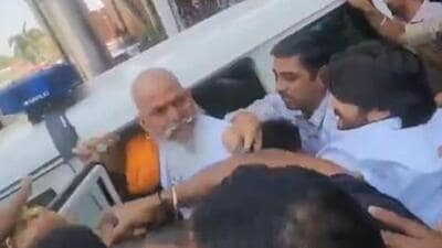 Raj Shekhawat released a video of police personnel pushing him into the vehicle, saying it wasn’t just his turban that had fallen but that of the entire community. (X/Screengrab) Raj Shekhawat released a video of police personnel pushing him into the vehicle, saying it wasn’t just his turban that had fallen but that of the entire community. (X/Screengrab)