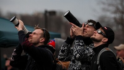 People assemble to view a total solar eclipse, where the moon blot out the sun, during totality at Niagara Falls, New York, U.S. (REUTERS)