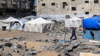 A man walks past tents and shacks erected by destroyed buildings in Rafah in the southern Gaza Strip (Reuters) A man walks past tents and shacks erected by destroyed buildings in Rafah in the southern Gaza Strip (Reuters)