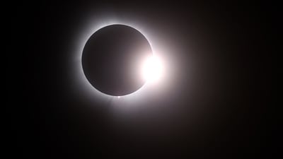 The moon passes in front of the sun during a solar eclipse on April 08, 2024 in Martin Ohio. Millions of people have flocked to areas across North America that are in the "path of totality" in order to experience a total solar eclipse. (Photo by Gregory Shamus / GETTY IMAGES NORTH AMERICA / Getty Images via AFP) (Getty Images via AFP) The moon passes in front of the sun during a solar eclipse on April 08, 2024 in Martin Ohio. Millions of people have flocked to areas across North America that are in the "path of totality" in order to experience a total solar eclipse. (Photo by Gregory Shamus / GETTY IMAGES NORTH AMERICA / Getty Images via AFP) (Getty Images via AFP)