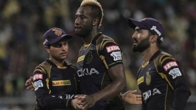 Kuldeep Yadav (L), Andre Russell (C) and Dinesh Karthik (R) (AP)