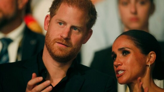 Harry, Duke of Sussex and patron of the Invictus Games (L), and his wife Meghan, Duchess of Sussex, attend the closing ceremony of the 2023 Invictus Games in Duesseldorf, western Germany on September 16, 2023. The Invictus Games, an international sports competition for wounded soldiers founded by British royal Prince Harry in 2014, was taking place from September 9 to 16, 2023 in Duesseldorf. (Photo by LEON KUEGELER / AFP) (AFP)